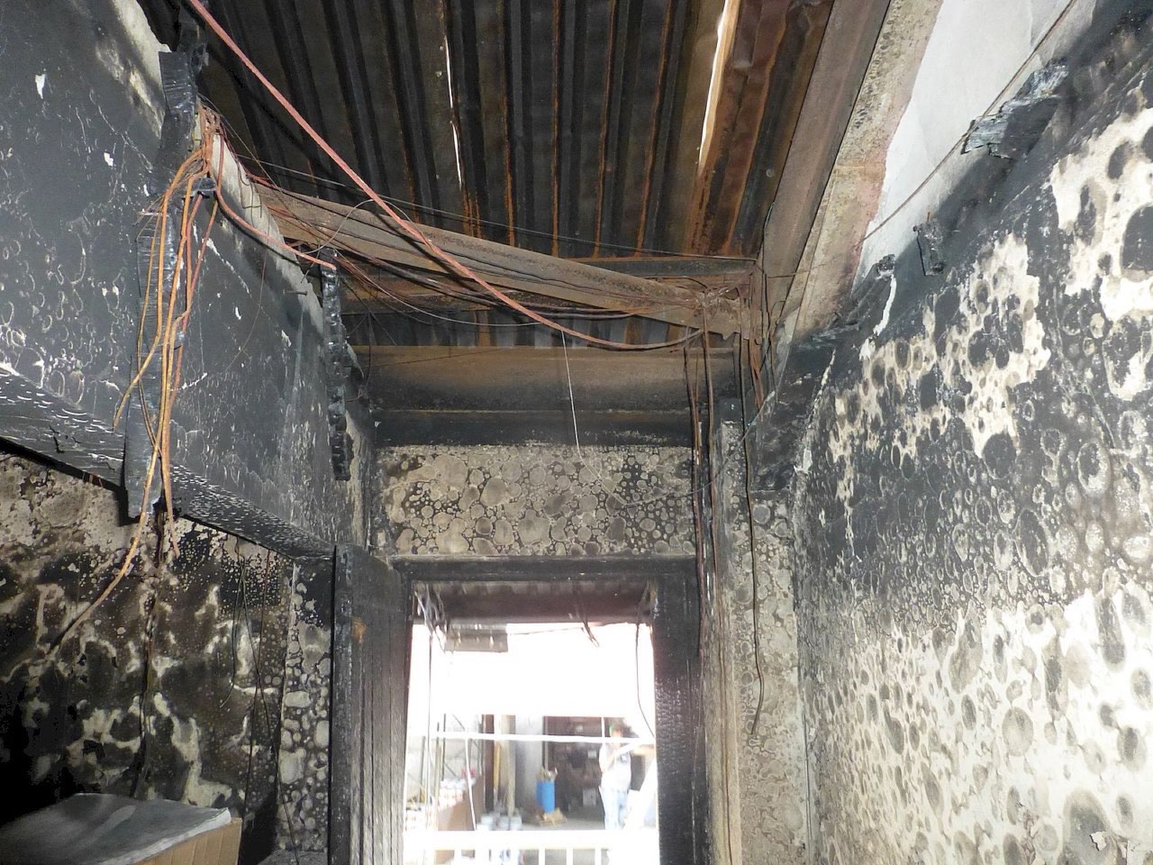 Fire Damage Assessments — fire-damaged corridor