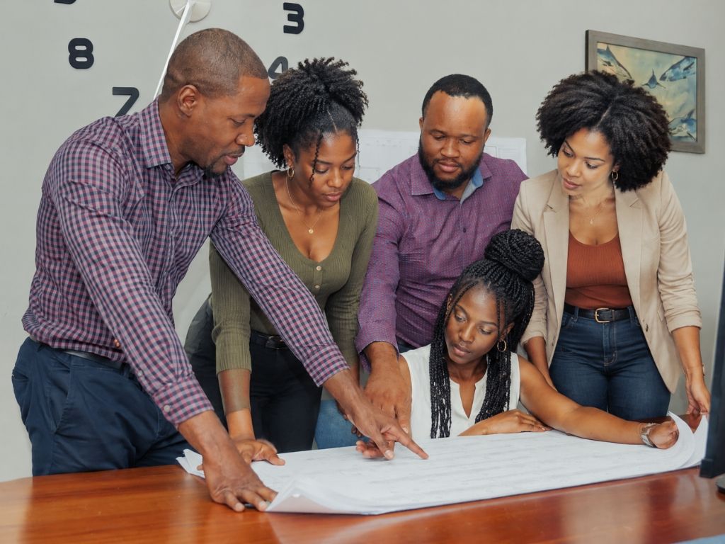 Engineers reviewing a set of drawings together
